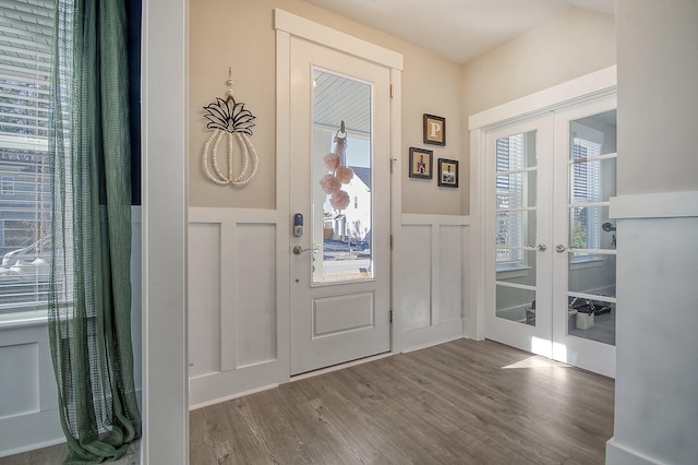 entryway with hardwood / wood-style flooring and french doors