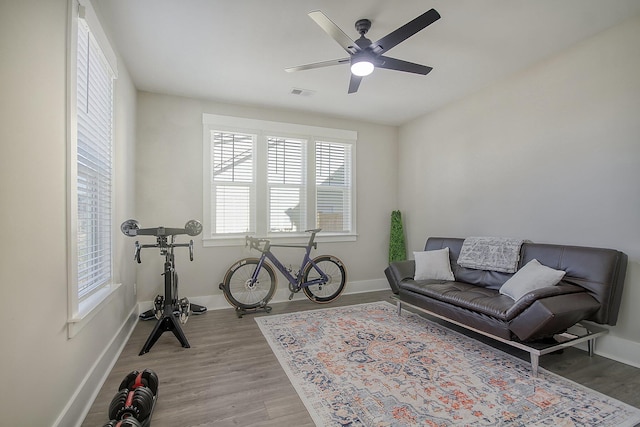 sitting room featuring ceiling fan and light hardwood / wood-style flooring