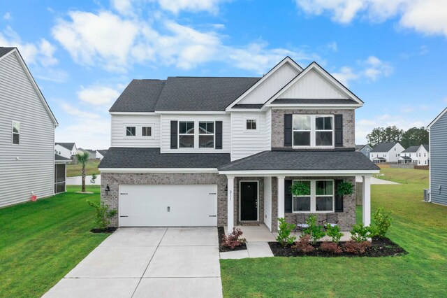 211 Squire Pope Rd, Summerville, SC 29486 - craftsman-style house with brick siding, a front yard, concrete driveway, and a shingled roof