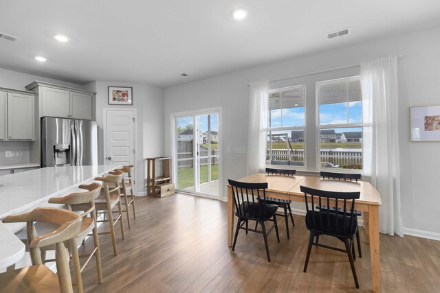211 Squire Pope Rd, Summerville, SC 29486 - dining room featuring wood finished floors, recessed lighting, and baseboards