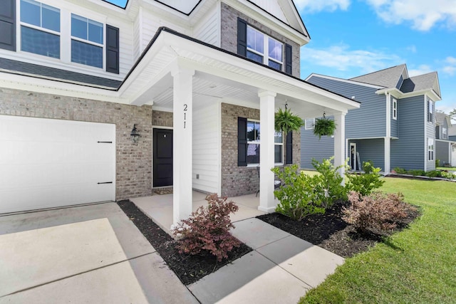 211 Squire Pope Rd, Summerville, SC 29486 - view of exterior entry featuring a porch, brick siding, a lawn, and stone siding