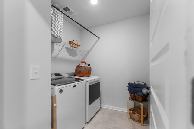 211 Squire Pope Rd, Summerville, SC 29486 - laundry room featuring washing machine and dryer and baseboards