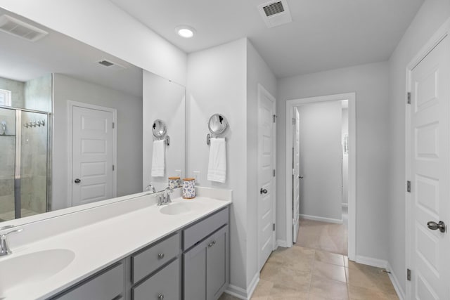 211 Squire Pope Rd, Summerville, SC 29486 - full bathroom featuring a stall shower, double vanity, baseboards, and tile patterned floors