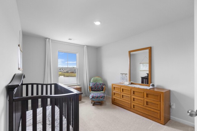 211 Squire Pope Rd, Summerville, SC 29486 - carpeted bedroom featuring a crib and baseboards