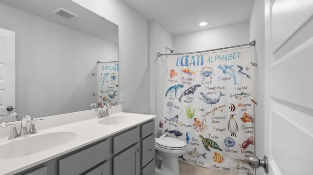 211 Squire Pope Rd, Summerville, SC 29486 - bathroom featuring toilet, double vanity, tile patterned flooring, and recessed lighting