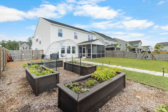 211 Squire Pope Rd, Summerville, SC 29486 - back of property featuring a sunroom, a garden, a playground, and a residential view