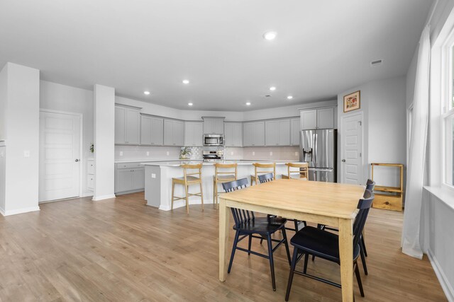 211 Squire Pope Rd, Summerville, SC 29486 - dining space featuring light wood-style floors, recessed lighting, and baseboards