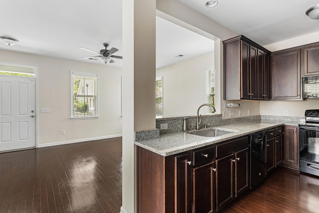 kitchen featuring range with electric cooktop, dark hardwood / wood-style floors, sink, dark brown cabinetry, and light stone countertops