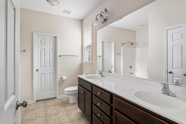 full bathroom featuring vanity, bathing tub / shower combination, and toilet