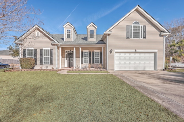 view of front of house featuring a garage and a front yard