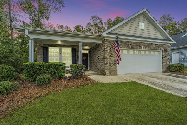 220 Brutus Ln, Summerville, SC 29485 - single story home with driveway, a garage, a front lawn, a porch, and brick siding