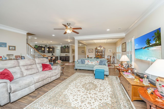 220 Brutus Ln, Summerville, SC 29485 - living area with a chandelier, wood finished floors, crown molding, ceiling fan, and stairs