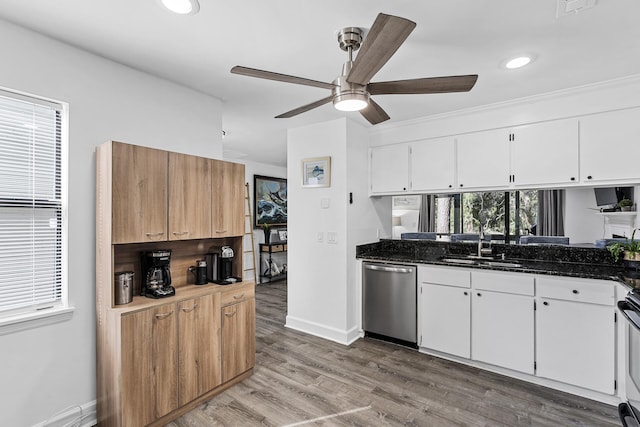 kitchen with white cabinetry, wood-type flooring, sink, and stainless steel dishwasher