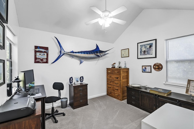 carpeted office space with vaulted ceiling and ceiling fan