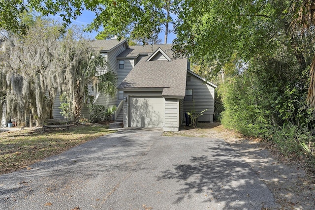 view of side of property featuring a garage