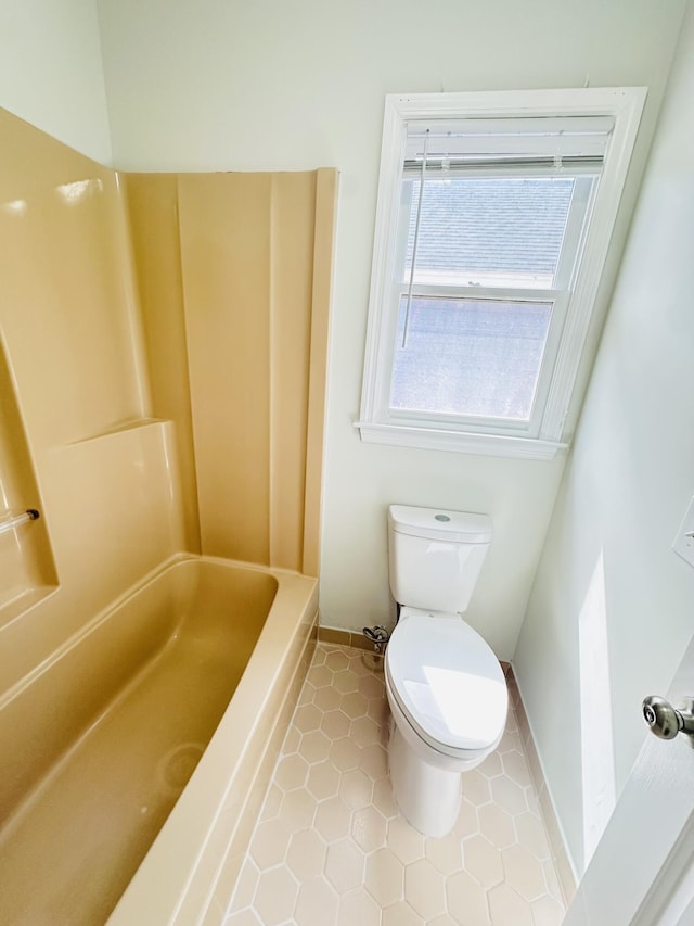 bathroom with tile patterned floors and toilet