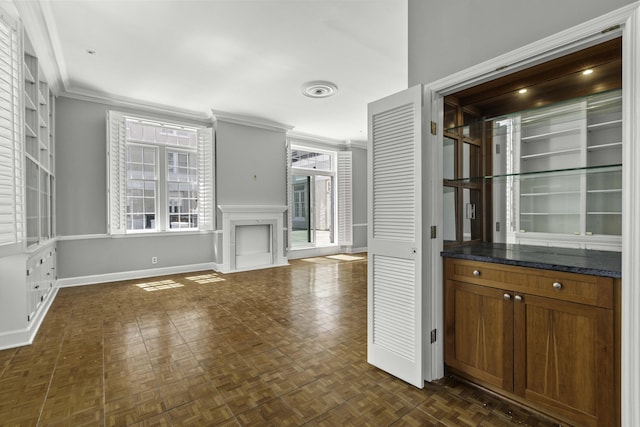 1 King Street 209 & 210, Charleston, SC 29401 - unfurnished living room featuring ornamental molding and a fireplace