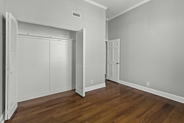1 King Street 209 & 210, Charleston, SC 29401 - unfurnished bedroom featuring crown molding, dark wood finished floors, and a closet