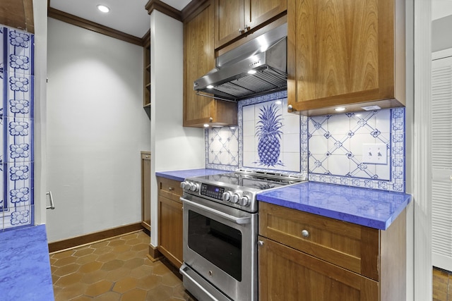 1 King Street 209 & 210, Charleston, SC 29401 - kitchen featuring stainless steel range with electric cooktop, under cabinet range hood, tasteful backsplash, crown molding, and brown cabinets