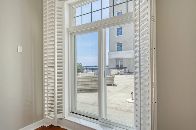 1 King Street 209 & 210, Charleston, SC 29401 - doorway to outside featuring baseboards
