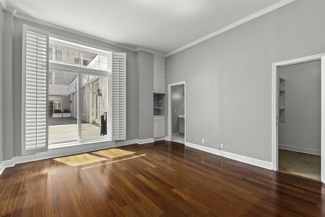 1 King Street 209 & 210, Charleston, SC 29401 - spare room with ornamental molding, dark wood finished floors, and built in features