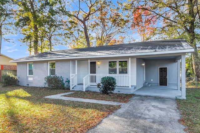 ranch-style house with a porch, a carport, and a front lawn