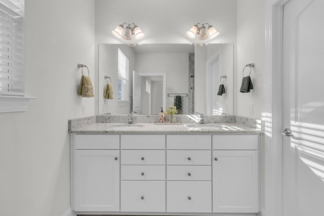 bathroom with double vanity and a sink