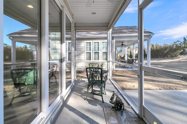 sunroom / solarium featuring ceiling fan