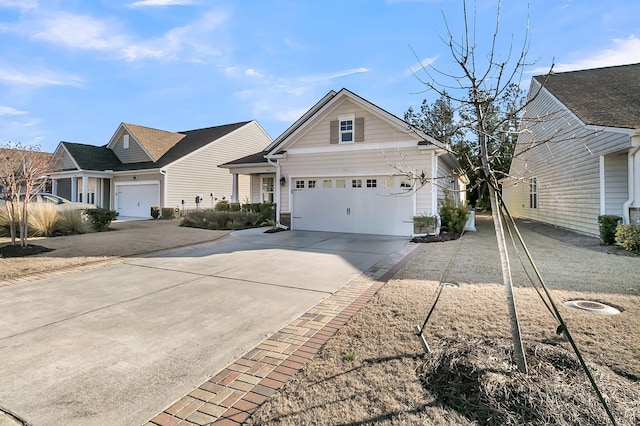 view of front facade with concrete driveway and a garage