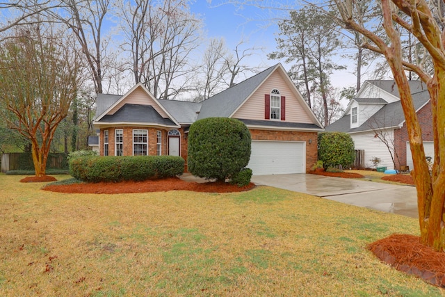 view of front of house featuring brick siding, a garage, a front lawn, and driveway