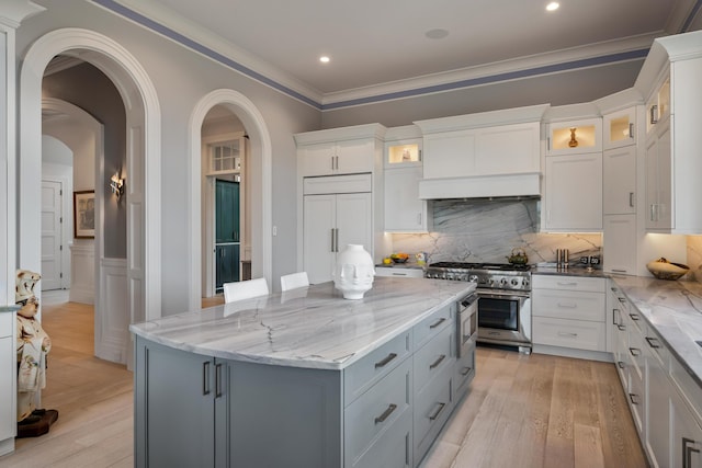 79 Trailing Vine Way, Kiawah Island, SC 29455 - kitchen featuring high end appliances, gray cabinetry, light stone counters, light wood-style floors, and white cabinetry