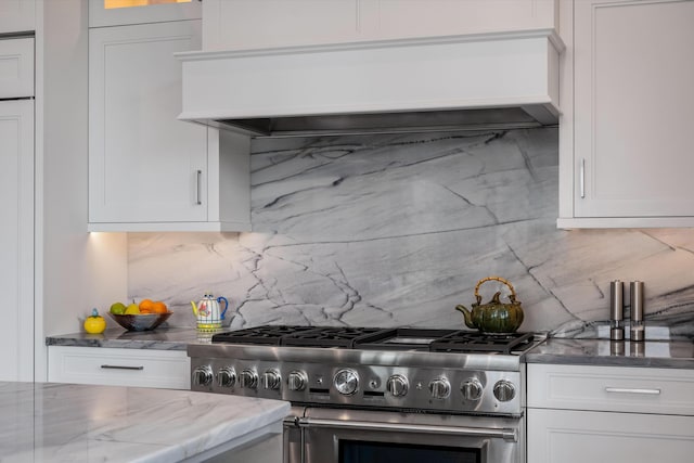 79 Trailing Vine Way, Kiawah Island, SC 29455 - kitchen featuring high end range, custom exhaust hood, tasteful backsplash, and light stone countertops