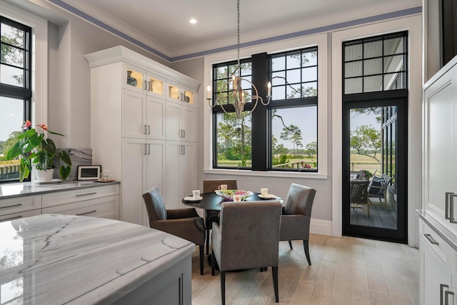 79 Trailing Vine Way, Kiawah Island, SC 29455 - dining space with a chandelier, plenty of natural light, light wood-style flooring, ornamental molding, and recessed lighting
