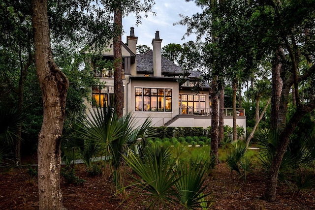 79 Trailing Vine Way, Kiawah Island, SC 29455 - back of property with a chimney and stucco siding