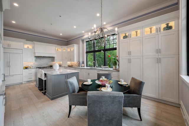 79 Trailing Vine Way, Kiawah Island, SC 29455 - dining space featuring crown molding, a chandelier, light wood finished floors, and recessed lighting