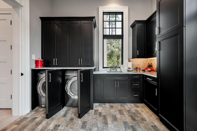 79 Trailing Vine Way, Kiawah Island, SC 29455 - laundry room featuring cabinet space and light wood finished floors