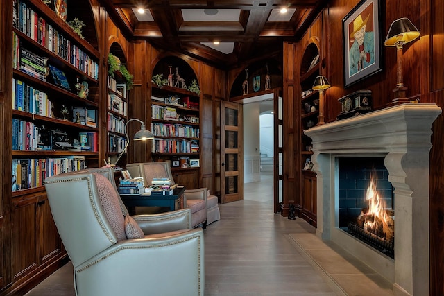 79 Trailing Vine Way, Kiawah Island, SC 29455 - sitting room with wood walls, built in shelves, coffered ceiling, beamed ceiling, and wood finished floors