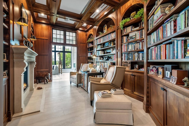79 Trailing Vine Way, Kiawah Island, SC 29455 - sitting room featuring coffered ceiling, beam ceiling, wood walls, built in shelves, and bookshelves