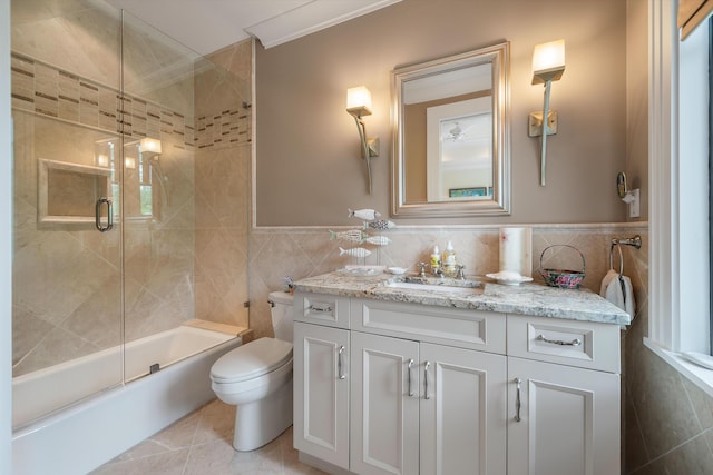 79 Trailing Vine Way, Kiawah Island, SC 29455 - bathroom with tile walls, vanity, bath / shower combo with glass door, and tile patterned floors