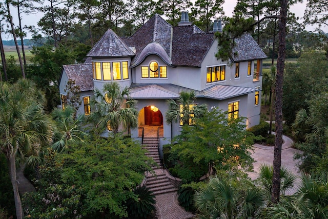 79 Trailing Vine Way, Kiawah Island, SC 29455 - view of front of property with a standing seam roof, stucco siding, stairs, and a metal roof