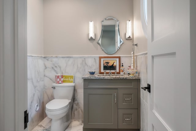 79 Trailing Vine Way, Kiawah Island, SC 29455 - half bath featuring vanity, wainscoting, marble finish floors, and tile walls