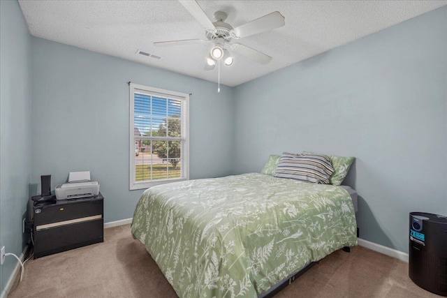 bedroom featuring visible vents, carpet, and baseboards