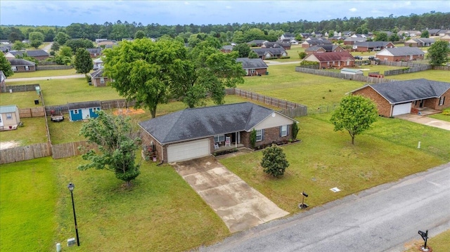 birds eye view of property with a residential view