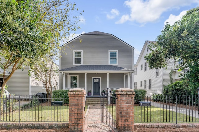 front of property with a porch and a front yard