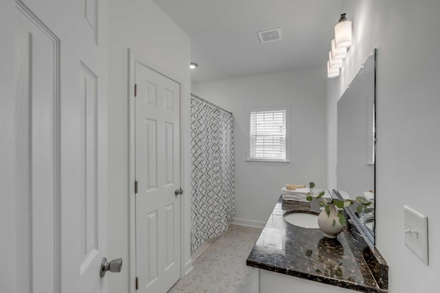 bathroom with vanity and a shower with shower curtain