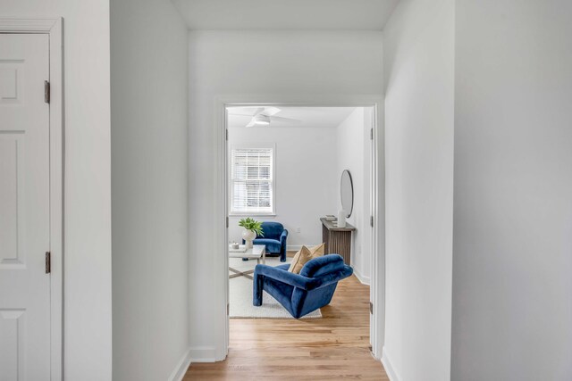 corridor with light wood-type flooring