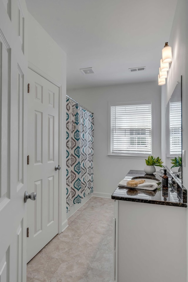 bathroom featuring vanity and a shower with curtain