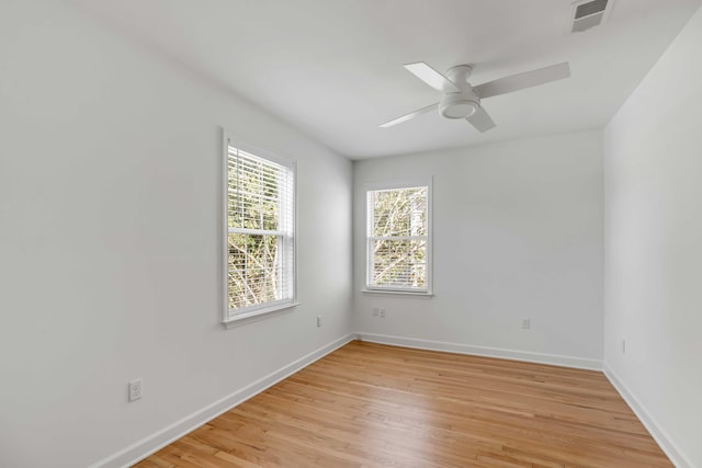 unfurnished room with ceiling fan and light wood-type flooring