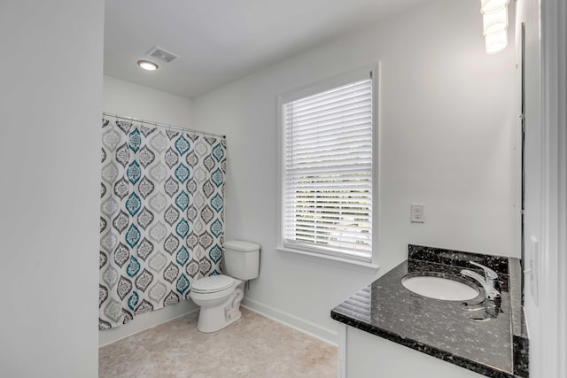 full bathroom with vanity, tile patterned floors, shower / bath combination with curtain, and toilet