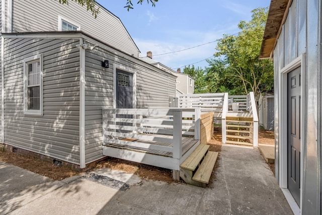 view of home's exterior featuring a wooden deck